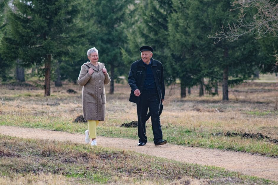An active senior couple walking outdoors